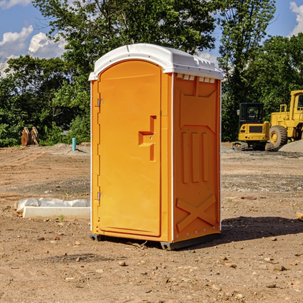 what is the cost difference between standard and deluxe portable restroom rentals in Orange Lake